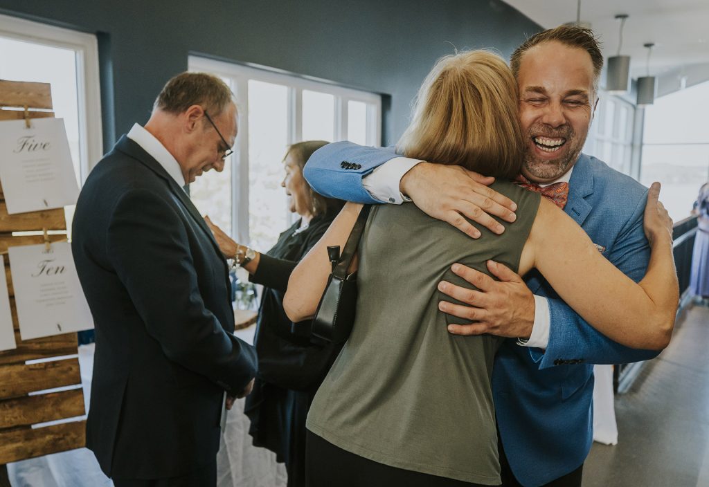 Emotional hug during an intimate wedding in Sudbury, Ontario captured by a Sudbury Ontario wedding photographer