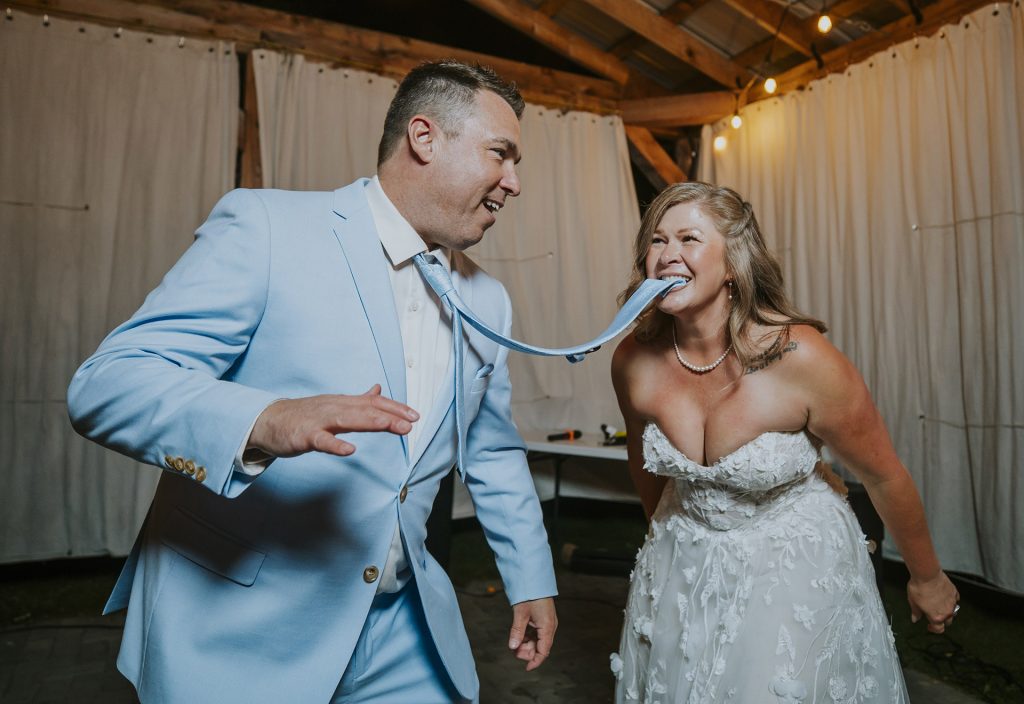 Bride and groom dancing and having fun during an intimate wedding in Sudbury, Ontario captured by a Sudbury Ontario wedding photographer