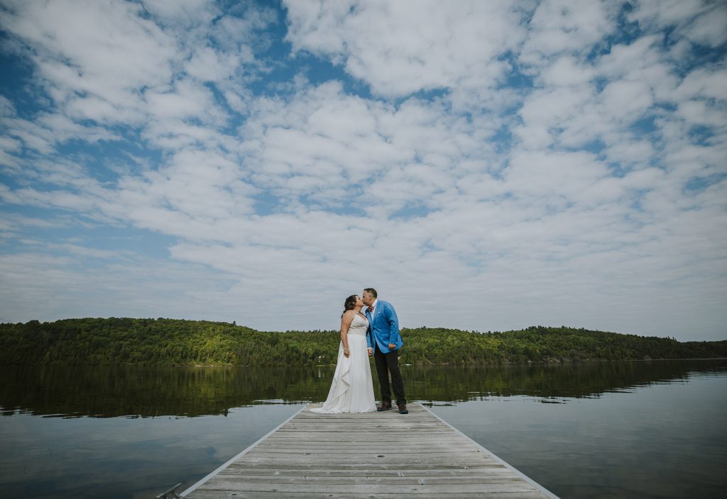 Couple's portrait in their dock during their wedding day in Sudbury, Ontario