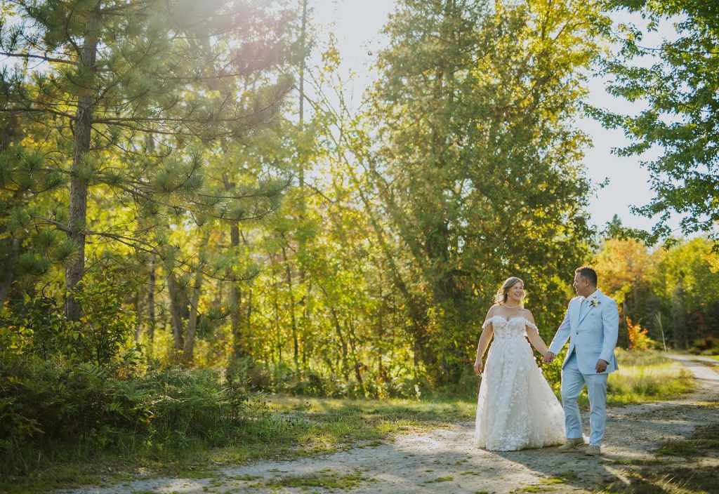 Bride and groom walking during the golden hour in Sudbury, Ontario