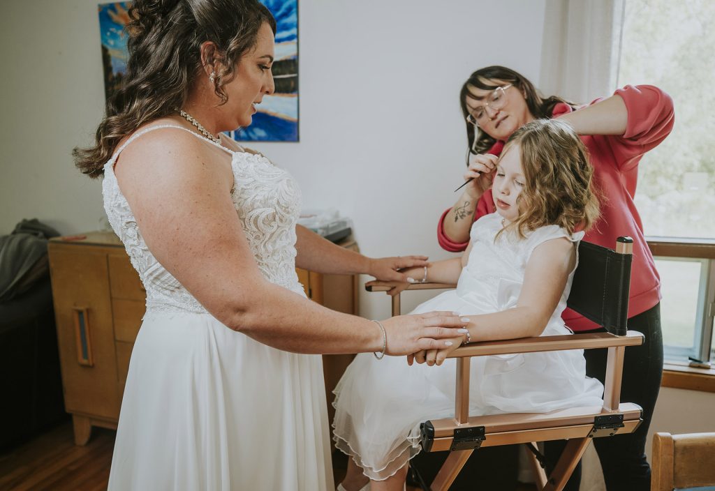 Ring bearer getting ready with the bride on her wedding day in Sudbury, Ontario
