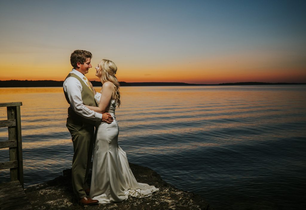 Couple portrait during sunset by the lake in Sudbury, Ontario