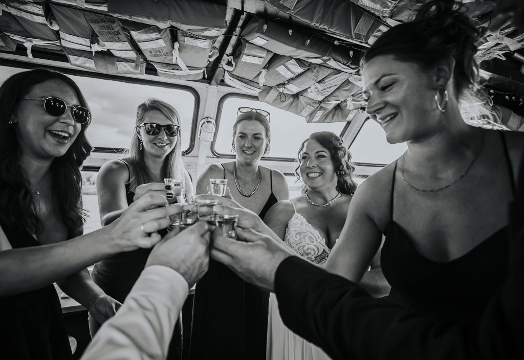 Bride and friends having a toast with tequila Couple portraits during sunset in Sudbury, Ontario